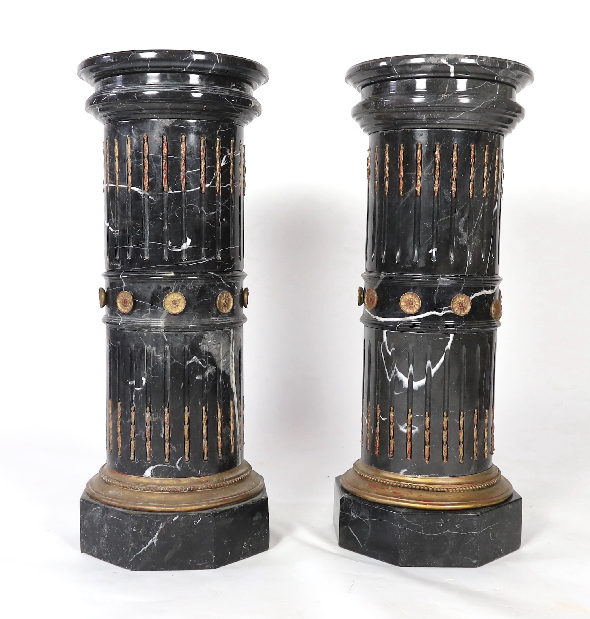 A pair of ornate variegated green marble columns, diameter 41cm, height 102cm